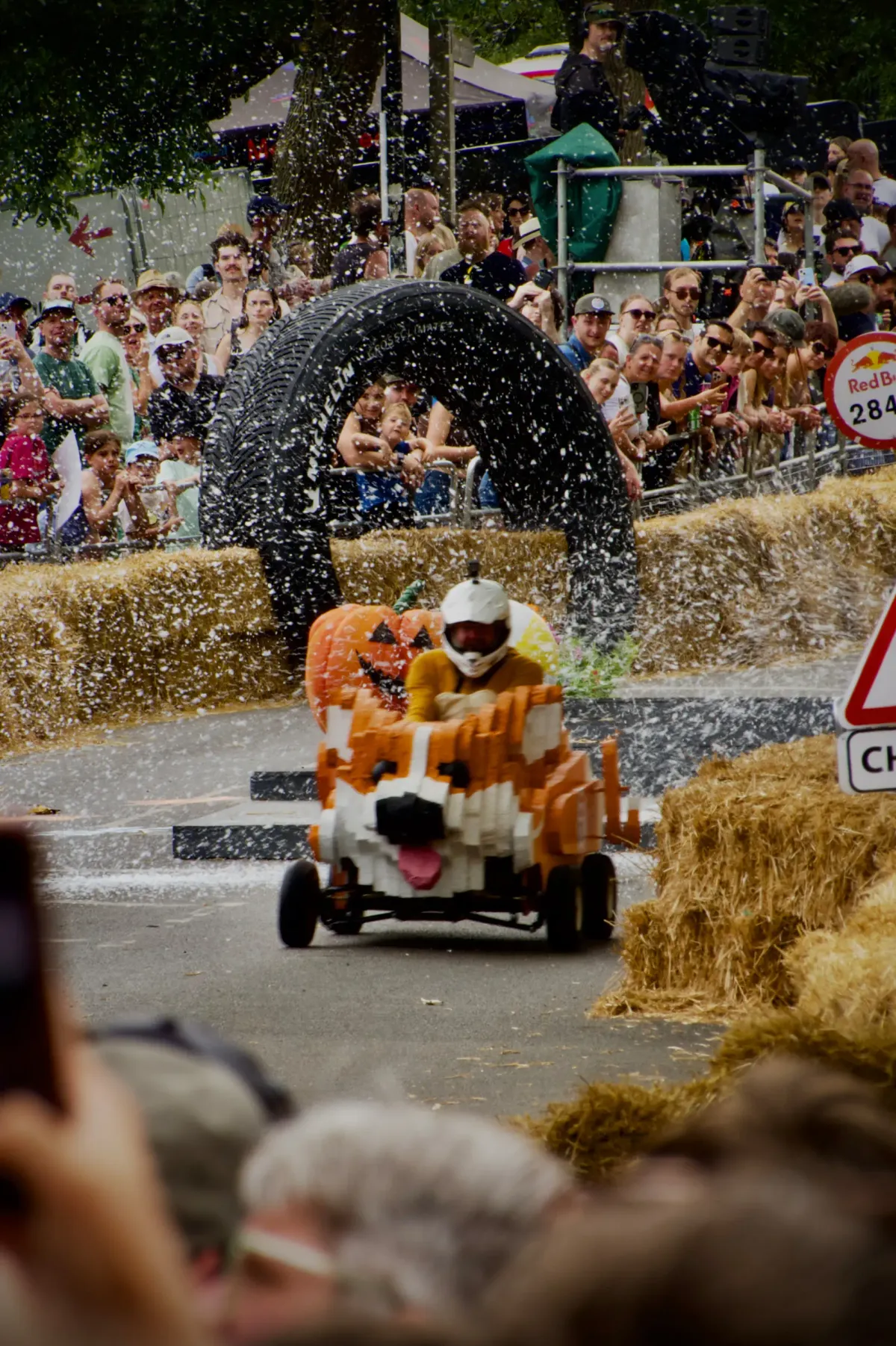 A homemade corgi soapbox kart racing downhill at Alexandra Palace in London.