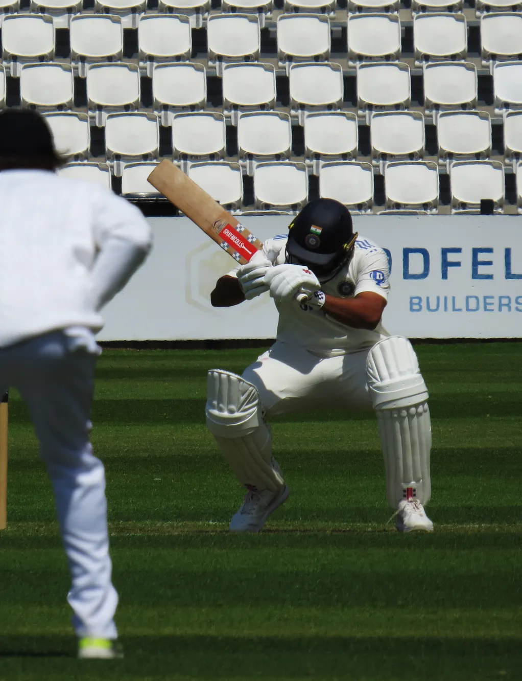 Karun Nair ducking to a bouncer bowled during the India vs England Lions warm-up game in Northampton.