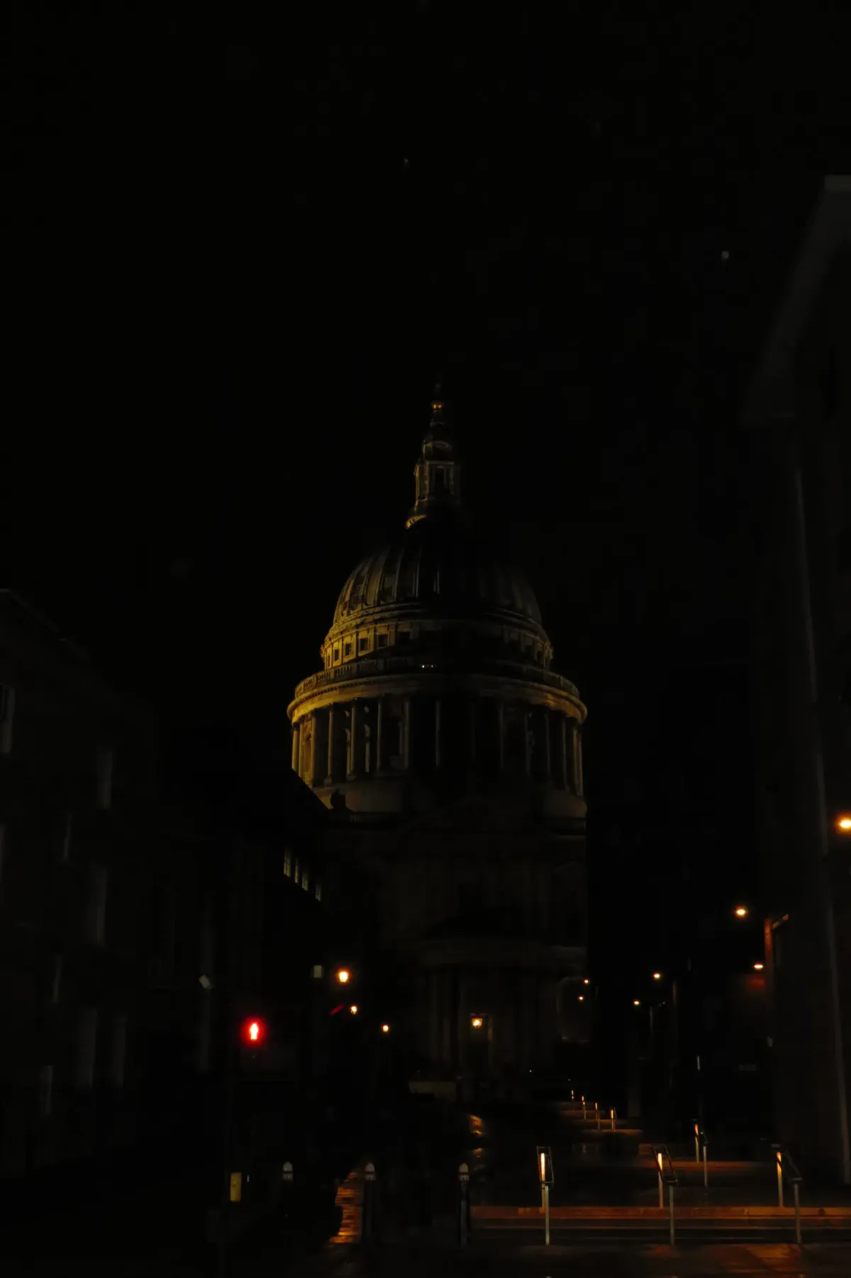 St Paul's Cathedral's dome rising above the dark London skyline at night.