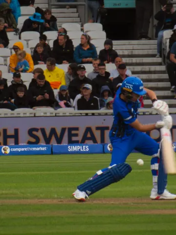 London Spirit's Issy Wong plays a square drive during a Hundred game as the wicketkeeper watches on.
